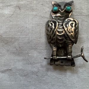 Owl pin.